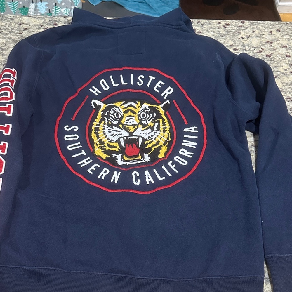 Hollister Dark Blue Sweatshirt with Tiger Emblem